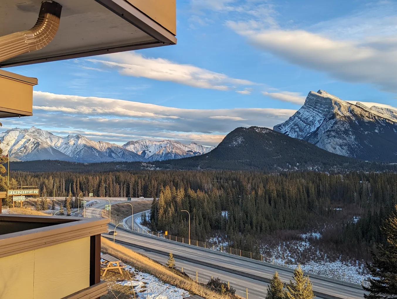View across the Trans-Canada Highway from The Juniper Hotel toward Mt. Rundle, Banff